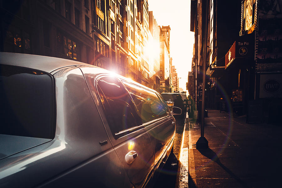 white limousine parking on street in Midtown Manhattan Photograph by Kolderal