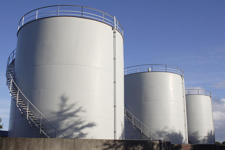White oil tanks for storing fuel appear to be blank canvases Photograph by Pejft