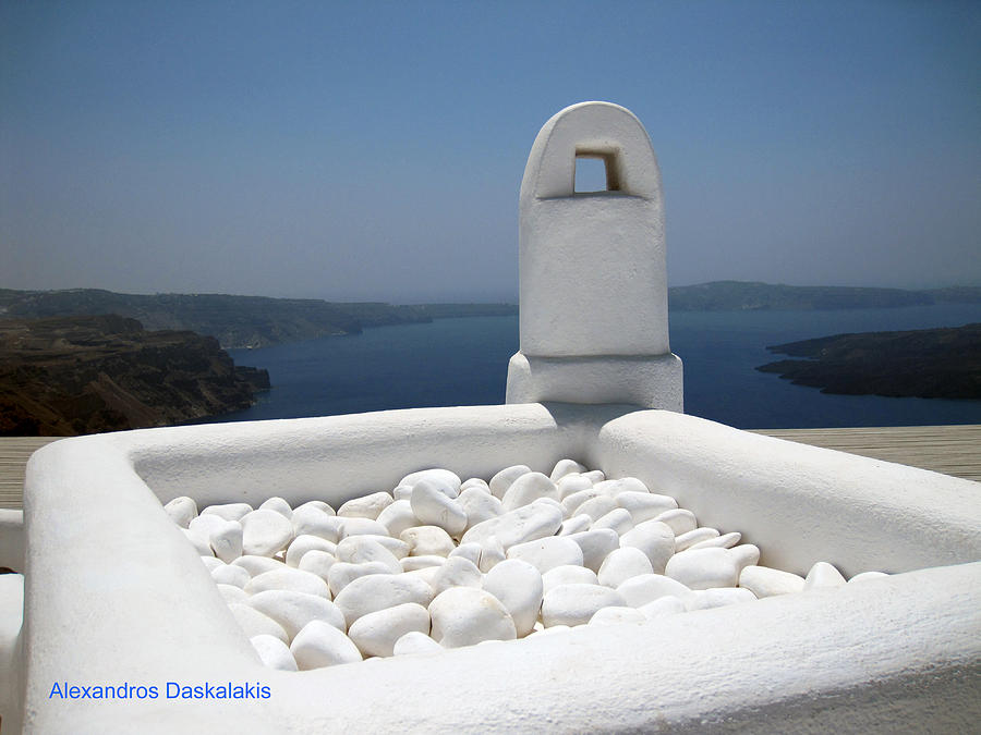 White Pebbles and Santorini Photograph by Alexandros Daskalakis