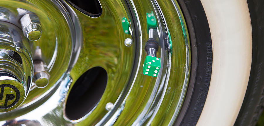 White Wall Tyre Chrome Rim And Dice Photograph by Mick Flynn