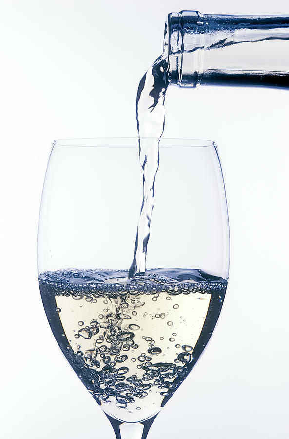 Wine Photograph - White wine pouring by Garry Gay