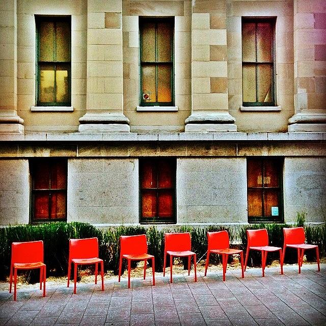 Seven Red Chairs Photograph by Julie Gebhardt