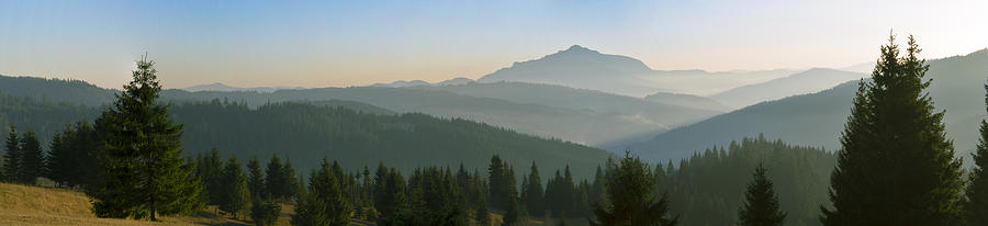 Sunset Photograph - Wide panorama with mountains at sunset in late November by Vlad Baciu