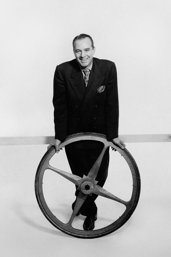 William Pahlmann Holding A Wheel Photograph by Herbert Matter