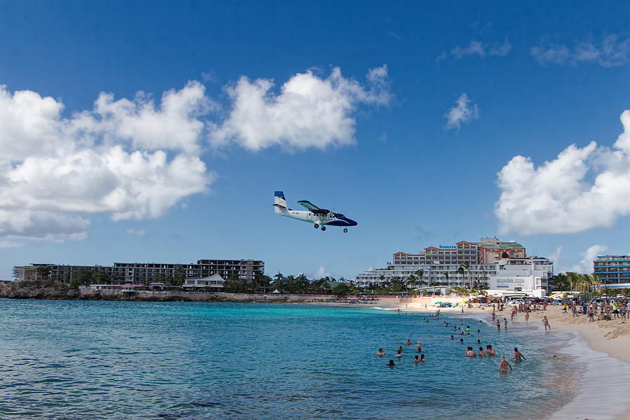 Winair low approach to St. Maarten Photograph by David Gleeson