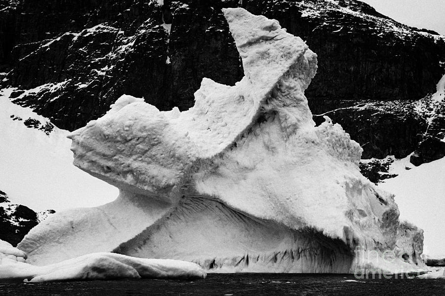 wind and tide shaped sculpted iceberg near cuverville island Antarctica ...