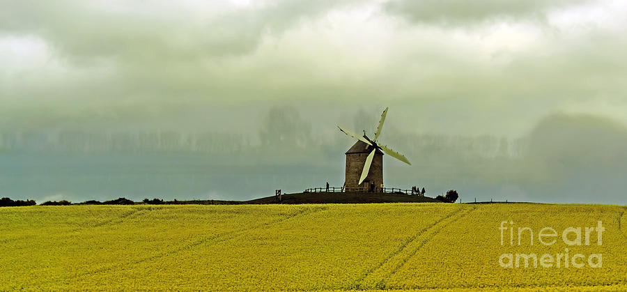 Windmill and Rapeseed and Storm Photograph by Elvis Vaughn