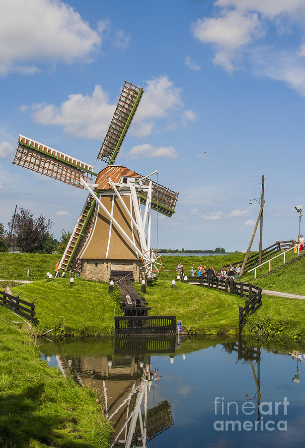 Fish Photograph - Windmill in a sunny Dutch landscape by Patricia Hofmeester