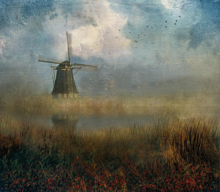 Windmill in mist Photograph by John Rivera