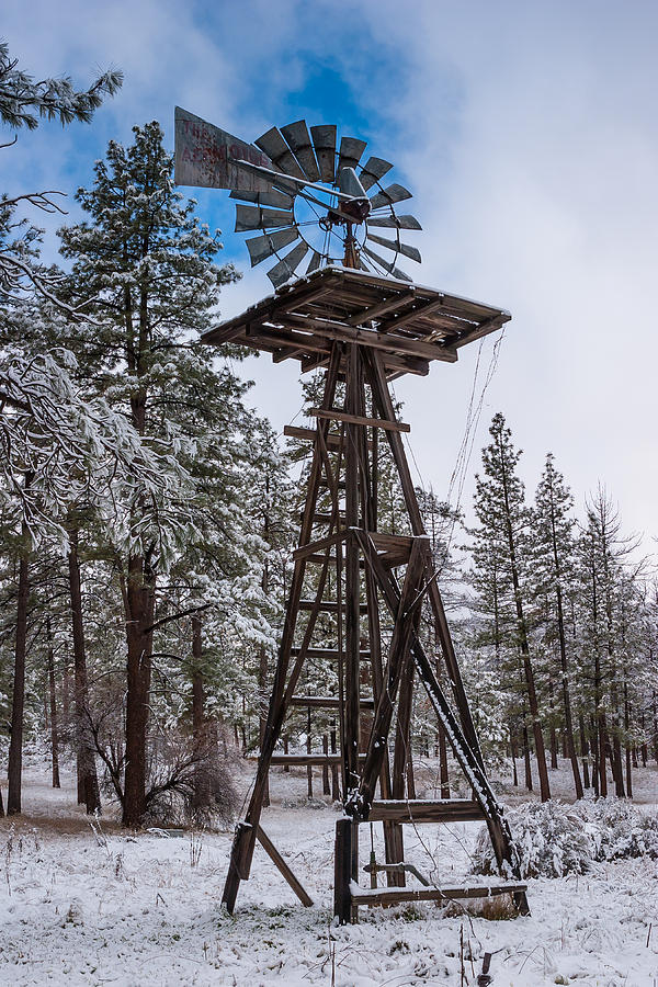 Windmill in the snow Photograph by Scott Campbell
