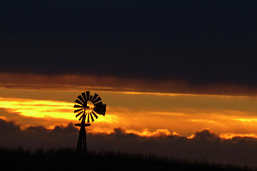 Sunset Photograph - Windmill Silhouetted Against The Sunset by Chuck Haney