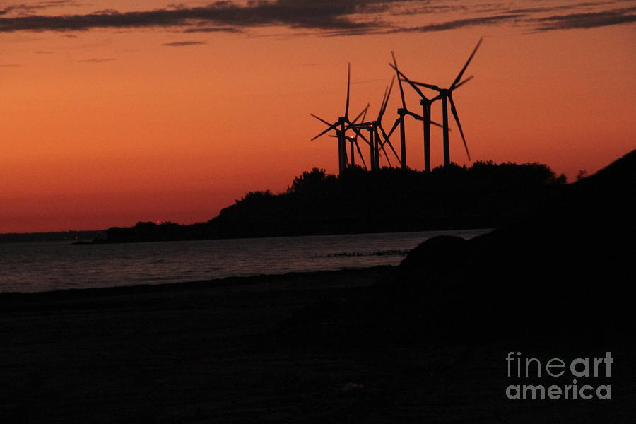 Windmills at sunset Photograph by Jim Lepard