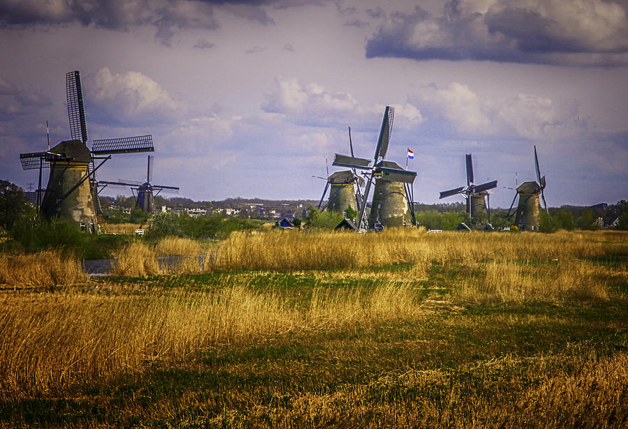 Windmills of Holland in Field Photograph by James Bethanis