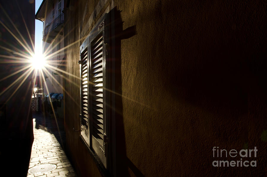 Window in an alley with sunlight Photograph by Mats Silvan