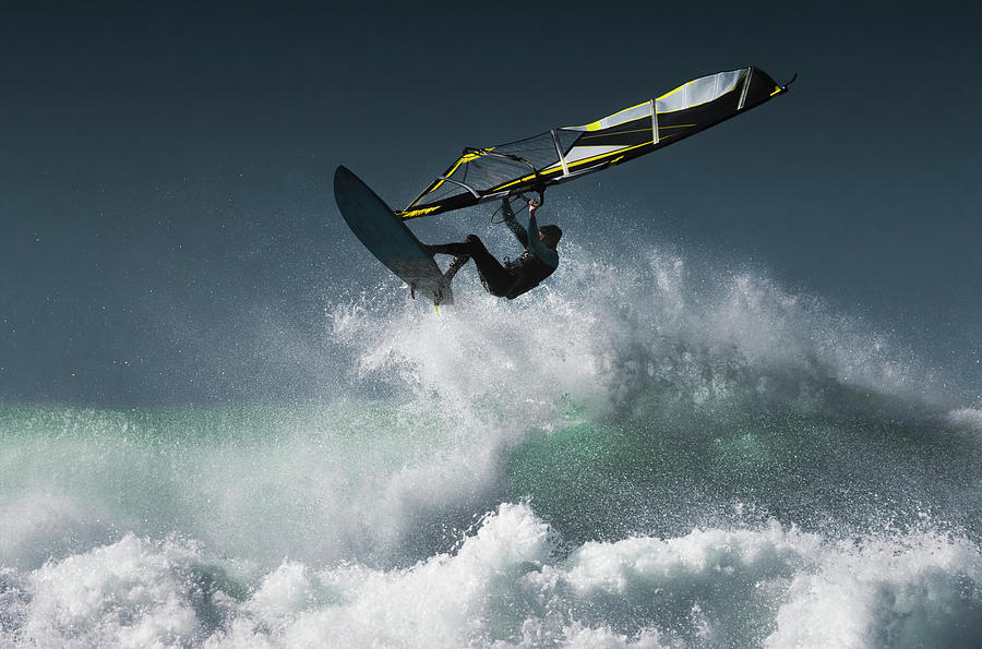 Windsurfer In The Air Above Splashing Photograph by Ben Welsh