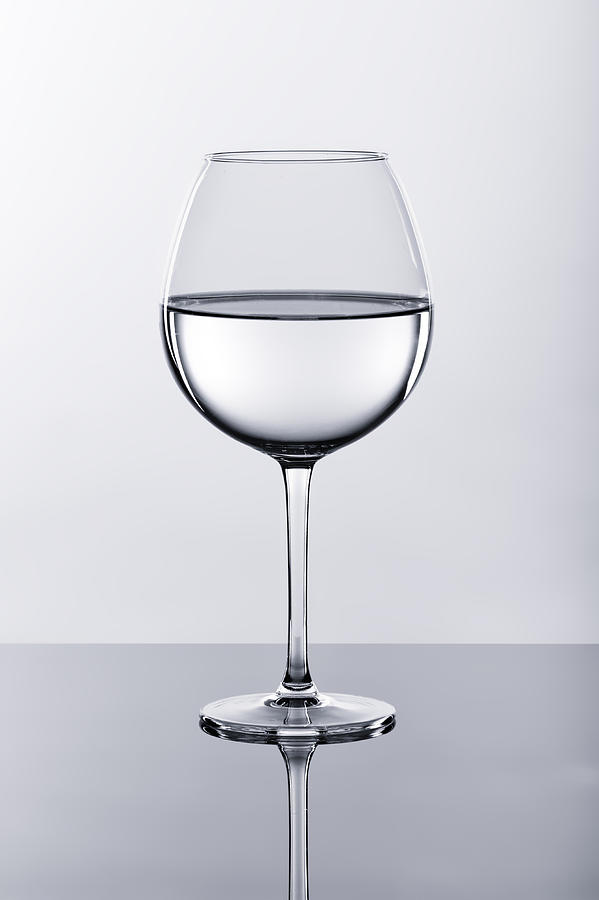 Black And White Photograph - Wine glass with water by Tomasz Sergej