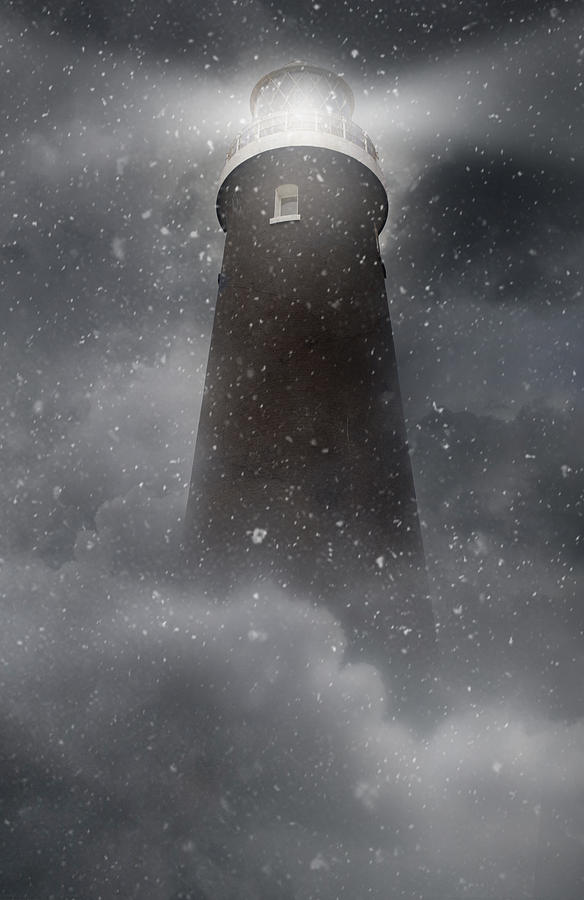 An old lighhouse with clouds and snow falling Photograph by Jaroslaw Blaminsky