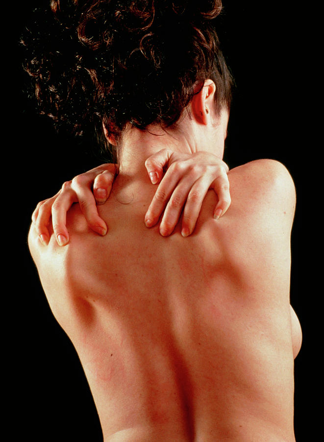 Woman Affected By Shoulder Pain Doing Self-massage Photograph by Seth Joel/science Photo Library