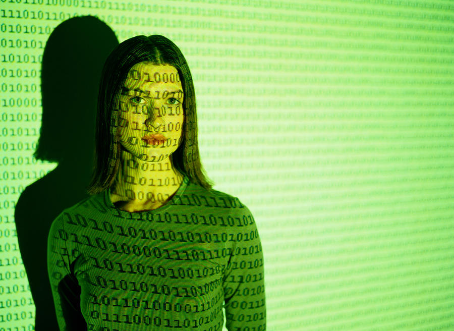 Woman and a Computer Graphics Projection Photograph by Ryan McVay