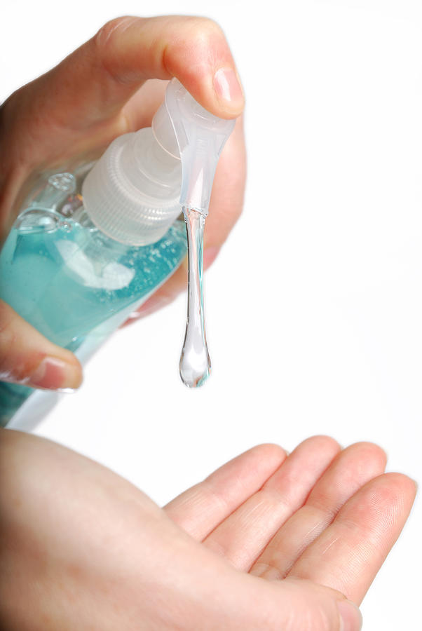 Woman applying hand sanitizer or soap Photograph by Matspersson0