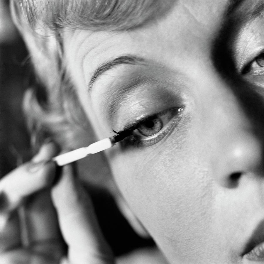 Woman Applying Mascara Photograph by Frances McLaughlin-Gill