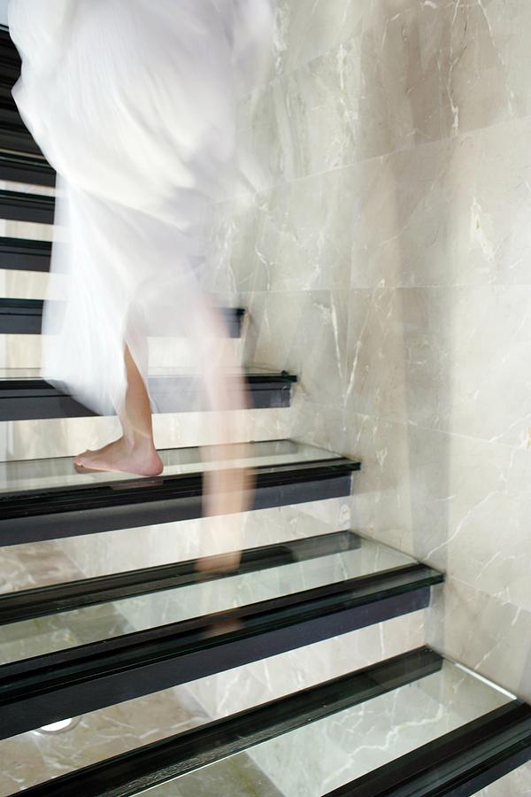 Woman Ascending Stairs Photograph by Ian Hooton/science Photo Library