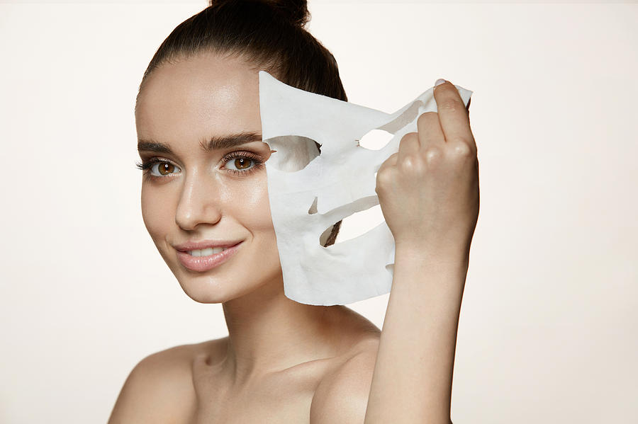 Woman Beauty Face. Young Female Removing Mask From Facial Skin Photograph by Puhhha