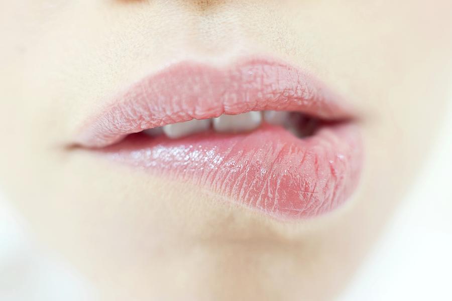 Woman Biting Lip Photograph By Ian Hooton Science Photo Library
