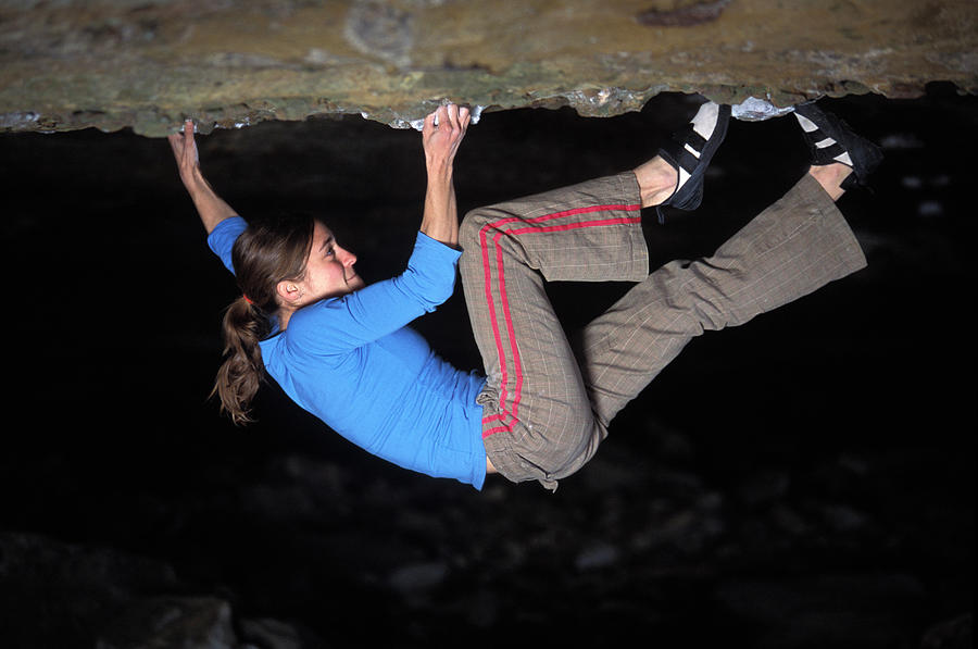 Adult Photograph - Woman Bouldering On A Difficult by Corey Rich