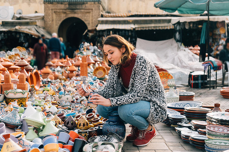 Woman choosing Ceramic  in shop in Meknes, Morocco Photograph by Oleh_Slobodeniuk