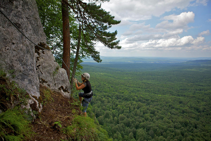 A Girl Is Hiking Beautiful Mountain by Evgeny Vasenev