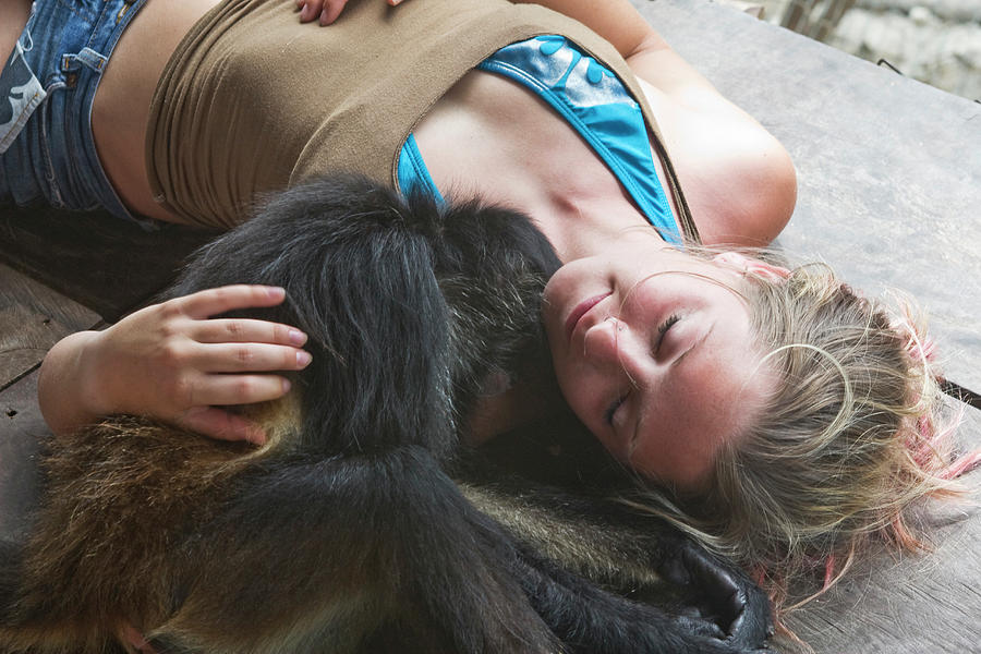 Animal Photograph - Woman Cuddles With Monkey In Mexico by Patrick Orton