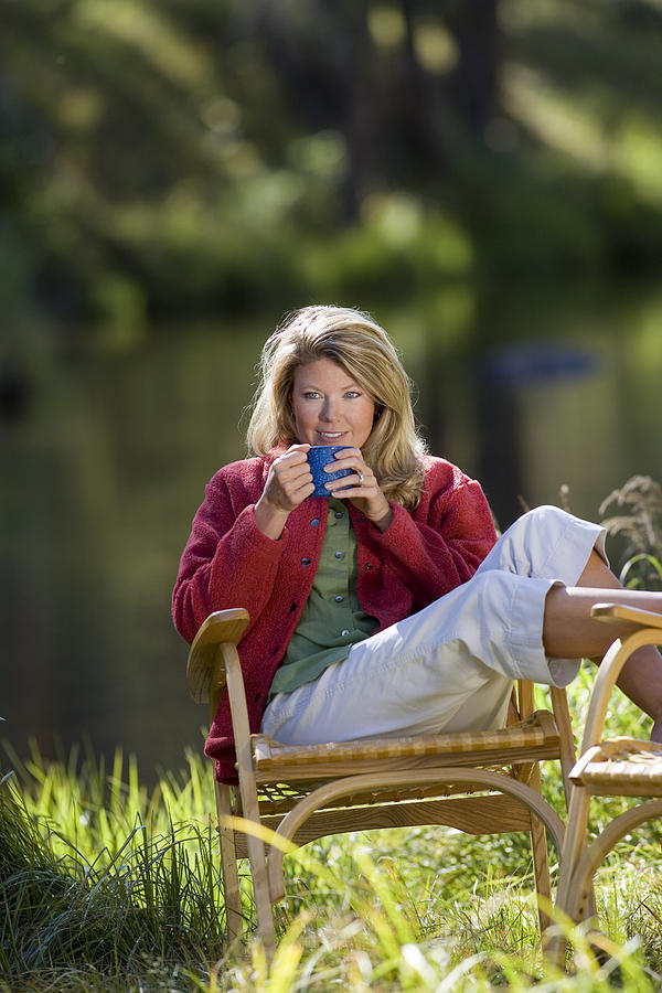 Woman drinking coffee Photograph by Comstock Images