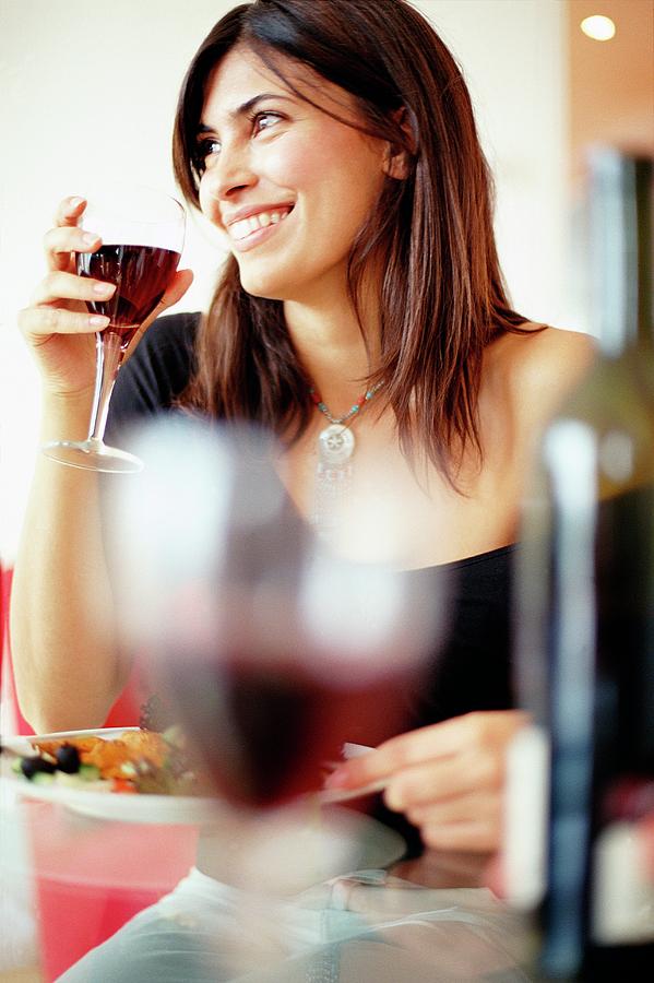 Woman Drinking Wine With Dinner Photograph By Ian Hooton Science Photo