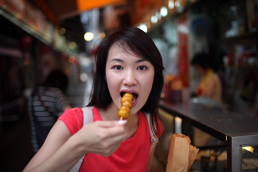 Woman Eating Delicious Fish Balls - XXXLarge Photograph by PhotoTalk