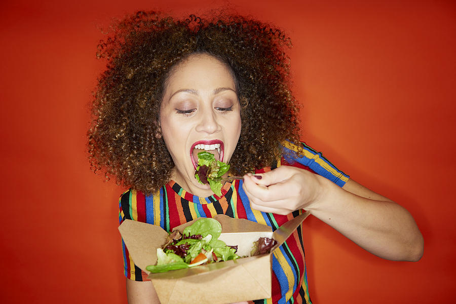 Woman Eating Salad Photograph by Tara Moore