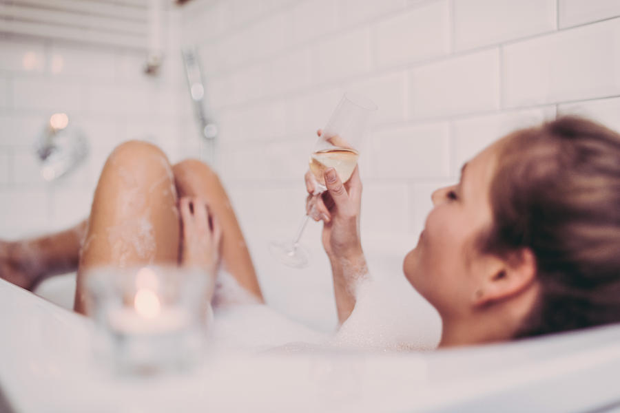 Woman enjoying a bath. Photograph by Guido Mieth