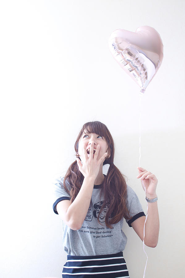 Woman enjoying baloon Photograph by Tadamasa Taniguchi