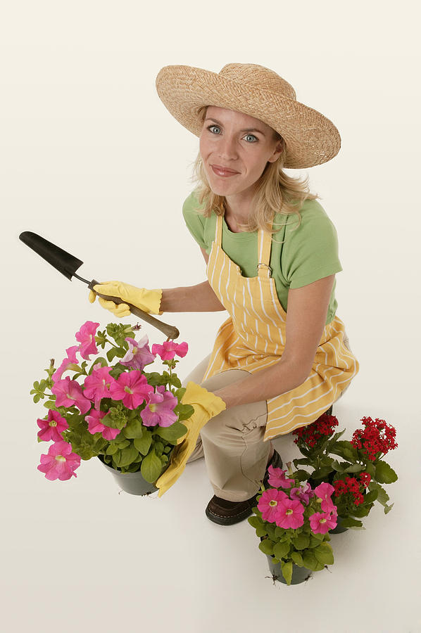 Woman gardening Photograph by Comstock Images