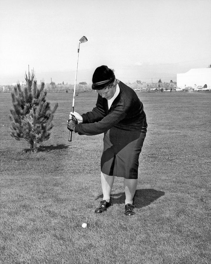 Woman Golfer Ready To Swing Photograph by Underwood Archives