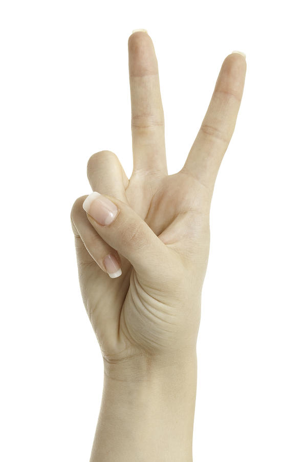 Woman hand showing peace sign isolated on white background Photograph by Deepblue4you
