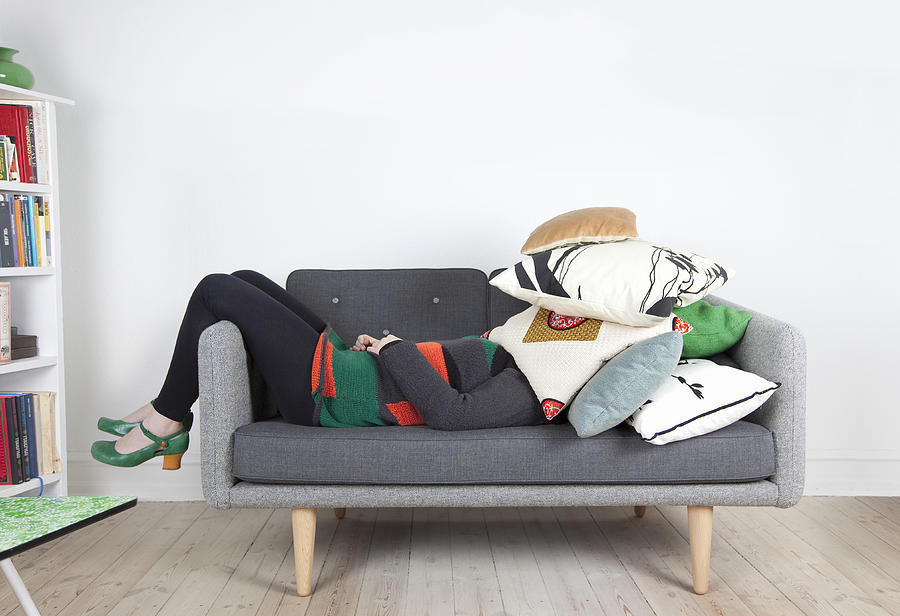 Woman hidden by pillows Photograph by Muriel de Seze