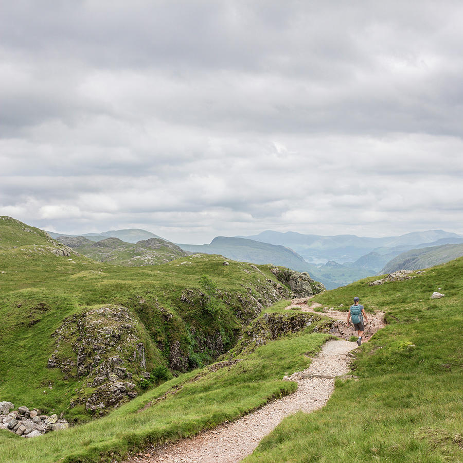 Woman Hiking In Lake District Photograph by David Madison