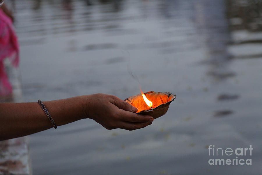Candle Photograph - Woman holding a candle beside the River Ganges in Rishikesh India by Robert Preston