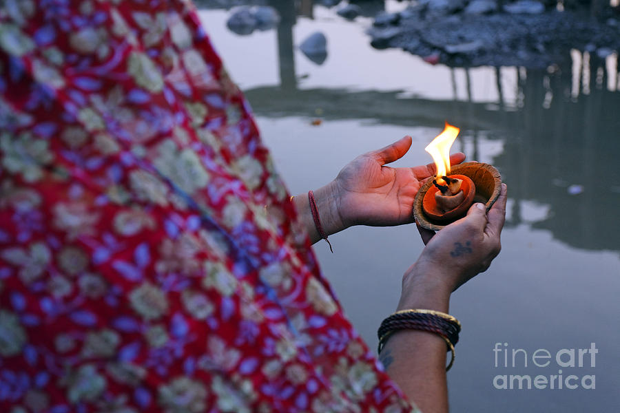 Candle Photograph - Woman holding a candle by the River Ganges in Rishikesh India by Robert Preston