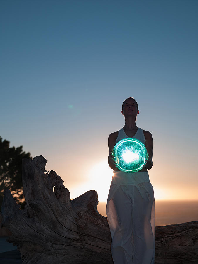 Woman holding an orb Photograph by Chris Ryan