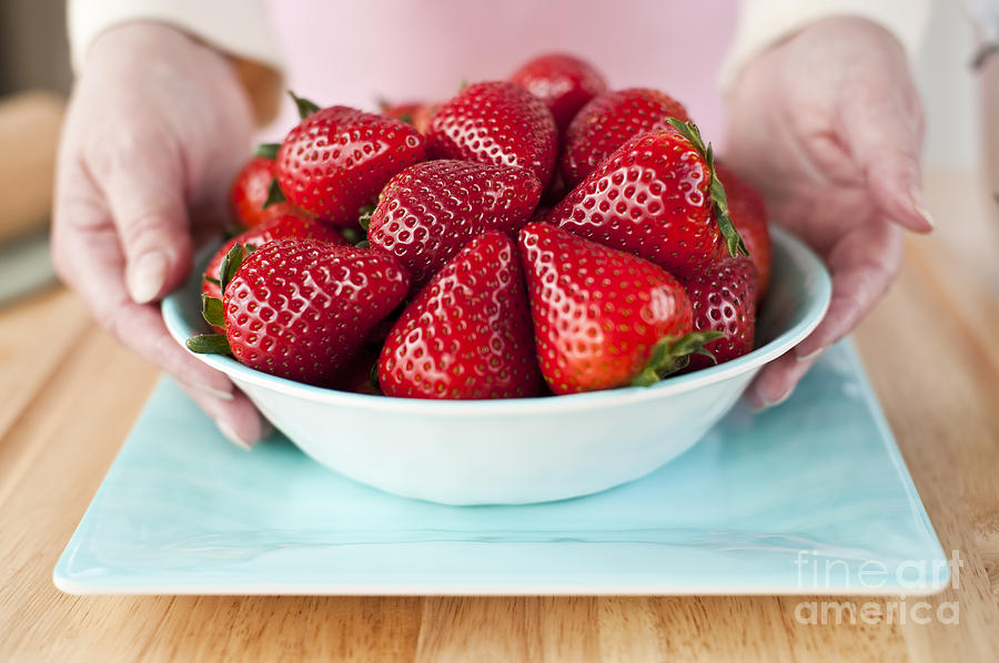 Woman Holding Bowl Of Ripe Strawberries Photograph by Jim Corwin