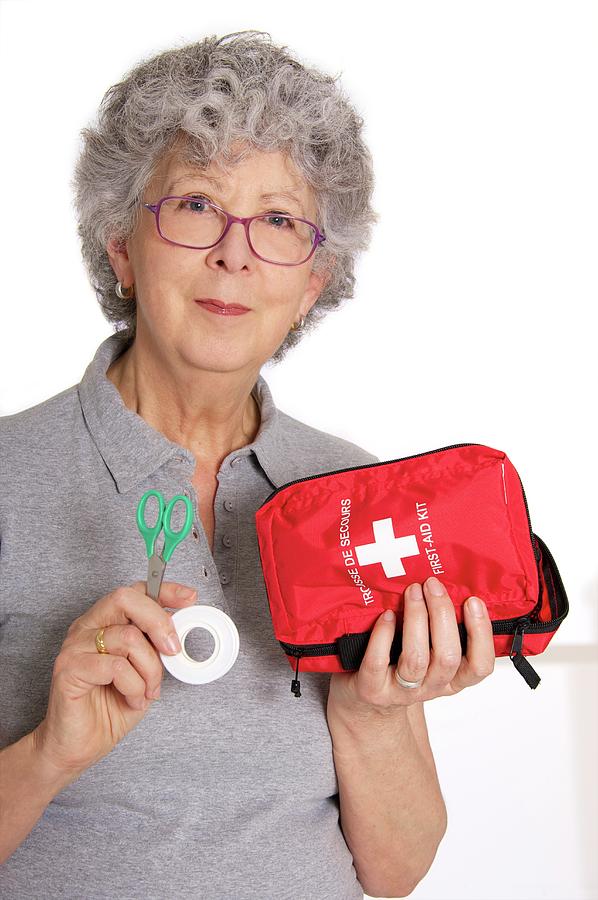 Woman Holding First Aid Kit Photograph by Lea Paterson