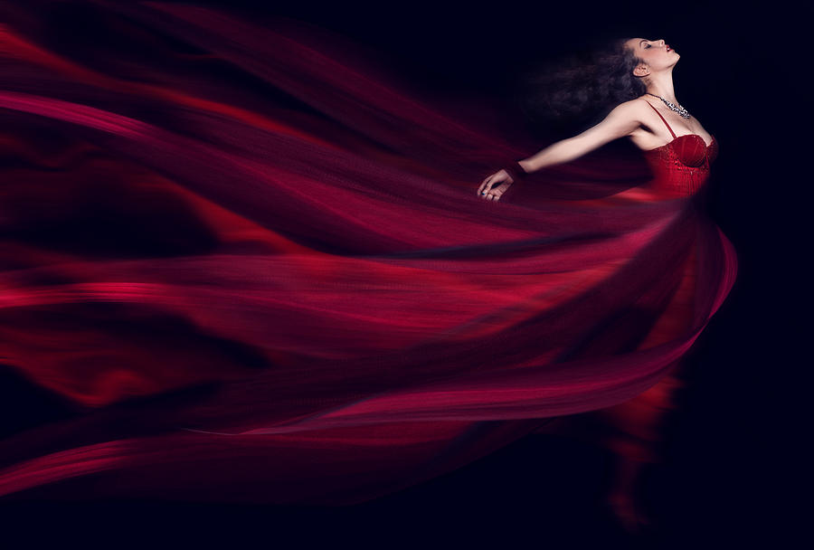 Woman in a long red flowing dress Photograph by Paper Boat Creative