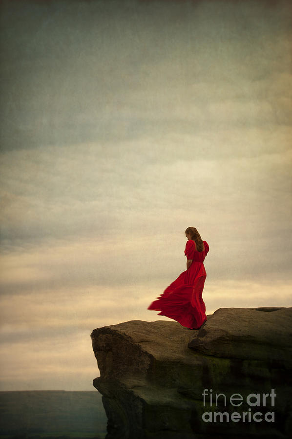 Woman In A Vintage Red Dress On A Windy Clifftop Photograph by Lee Avison